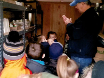kids touring food bank trailer